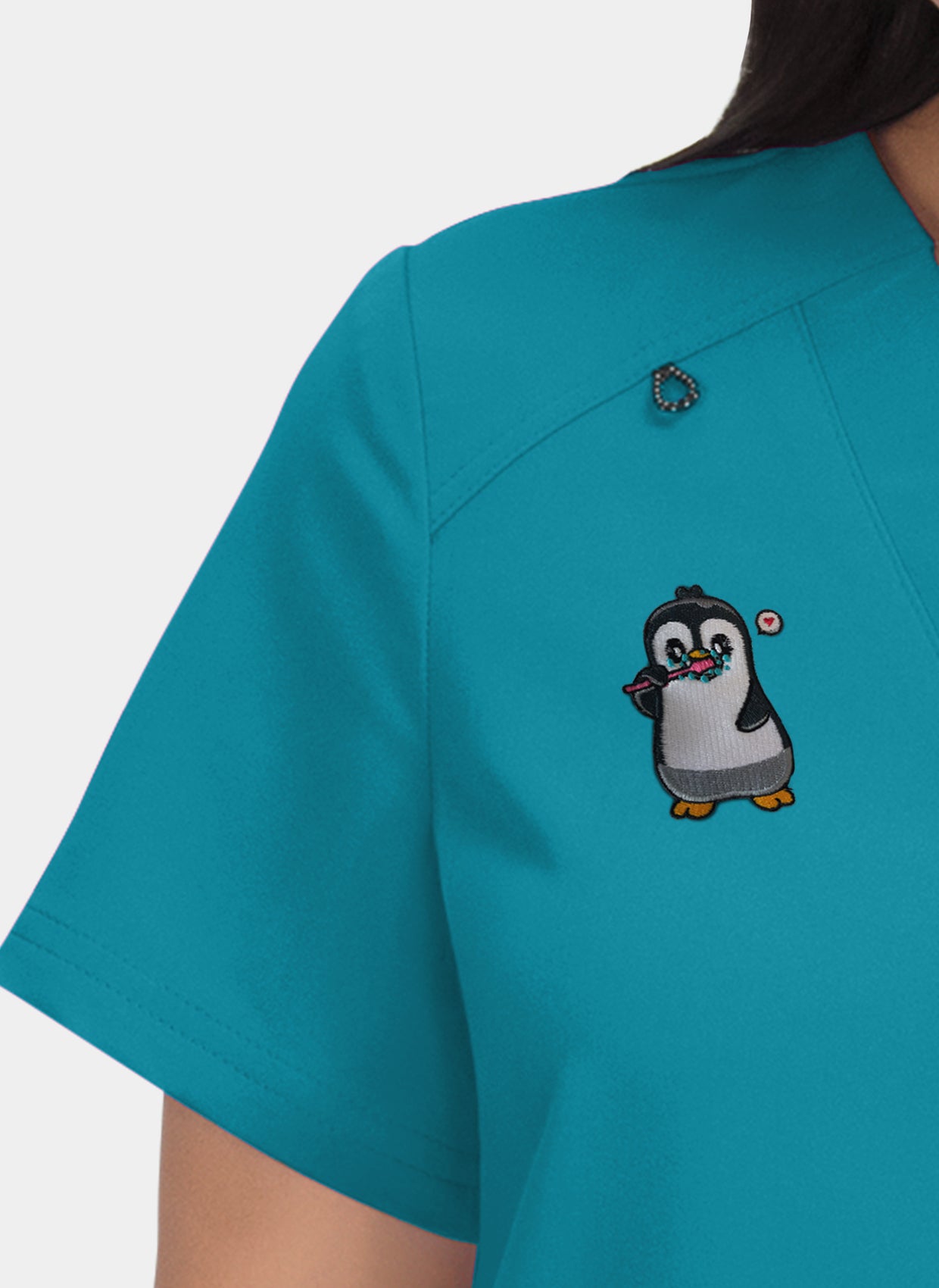 Hustle and heart teal embroidery close-up