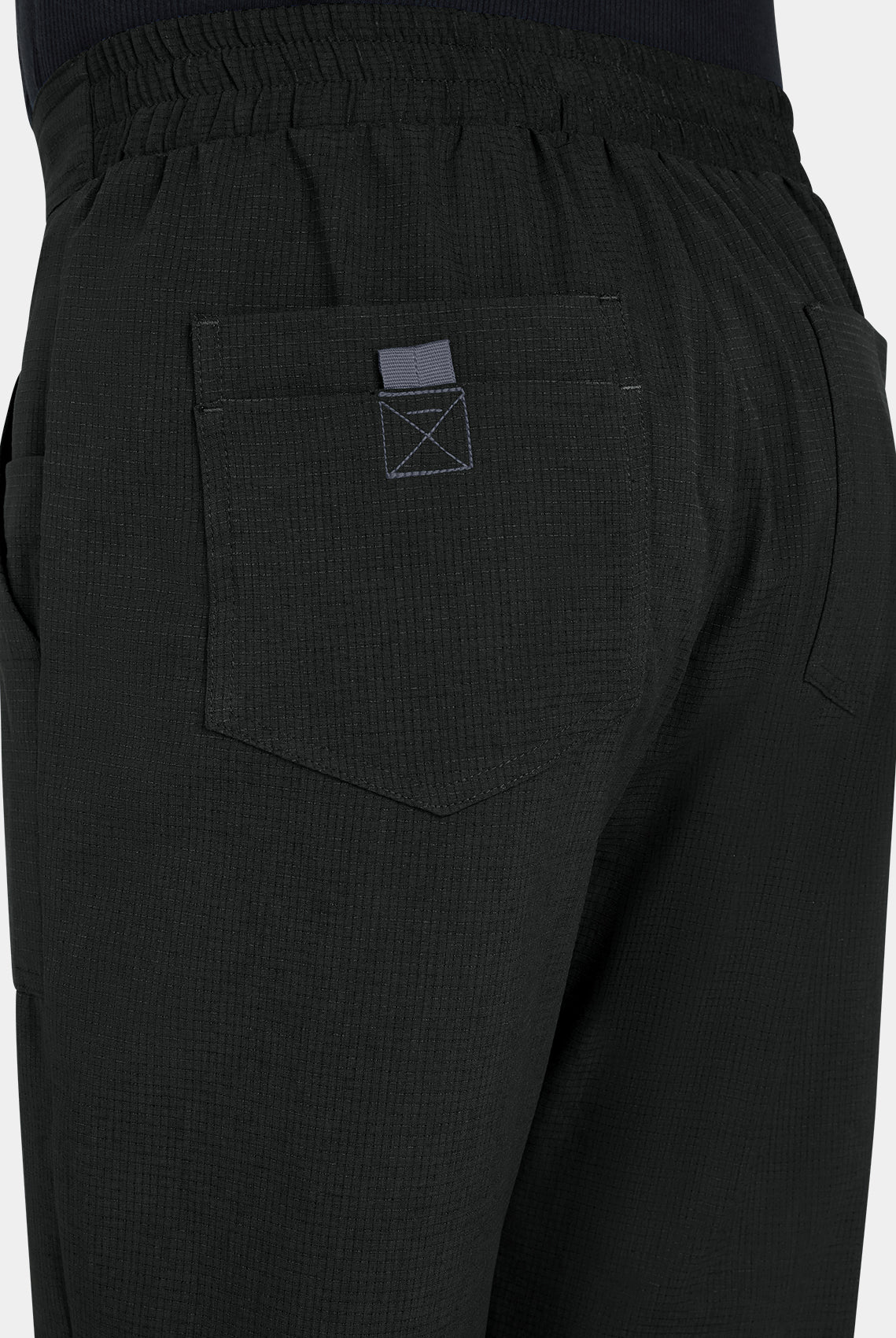 Close-up men's Koi Solis black scrub trousers