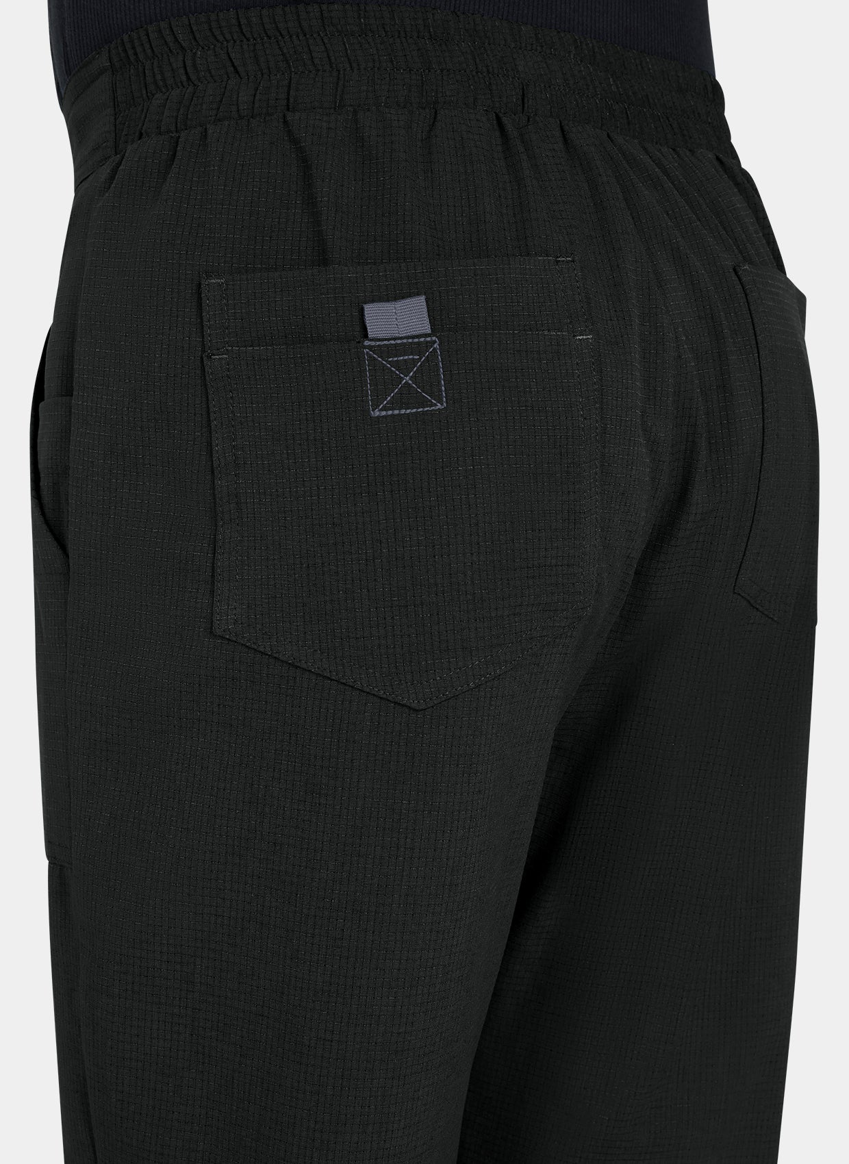 Close-up men's Koi Solis black scrub trousers