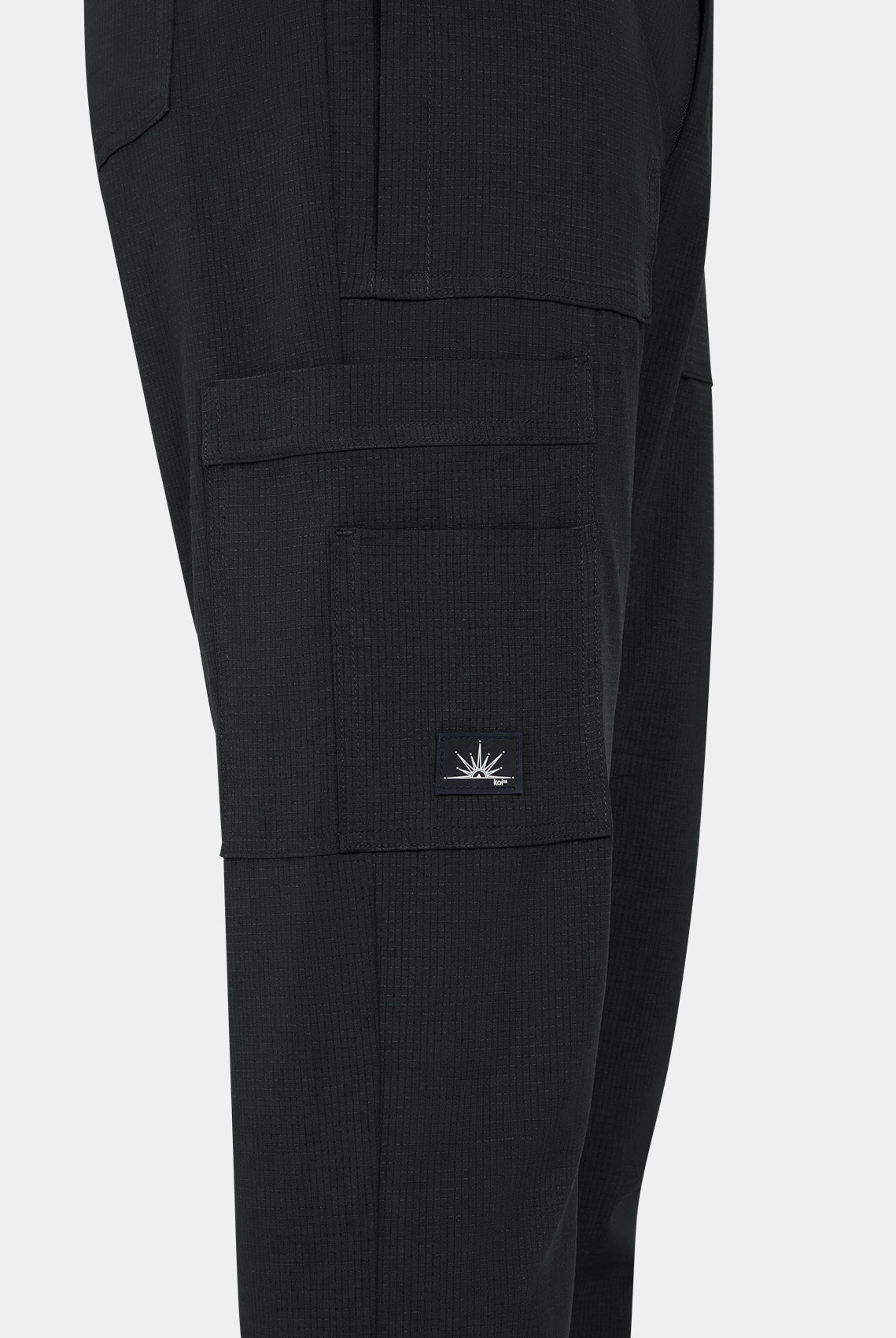 Close-up men's Koi Solis black scrub trousers