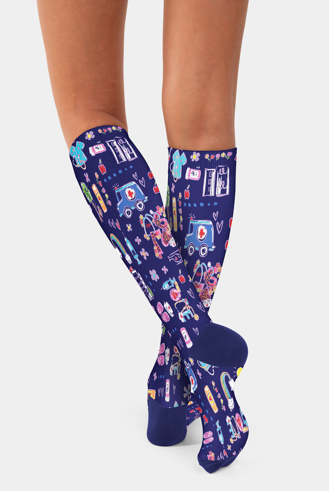 Navy blue knee-high compression socks with colourful ambulance pattern