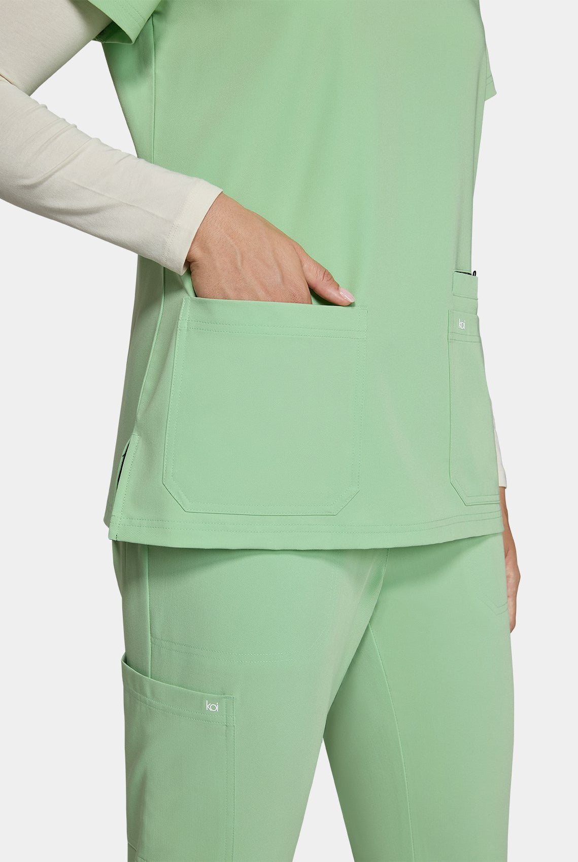 Women's Koi Next Gen Hustle and Heart Scrub Top in Pistachio