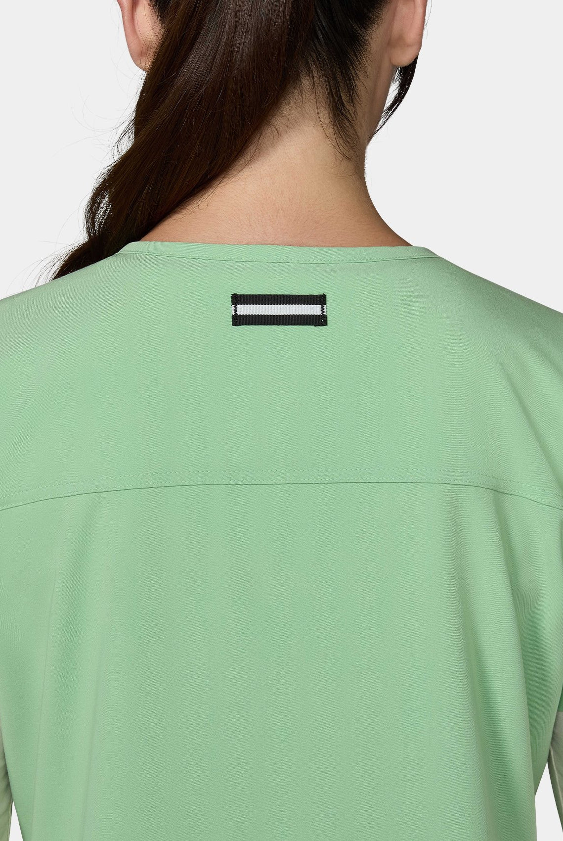 Women's Koi Next Gen Hustle and Heart Scrub Top in Pistachio