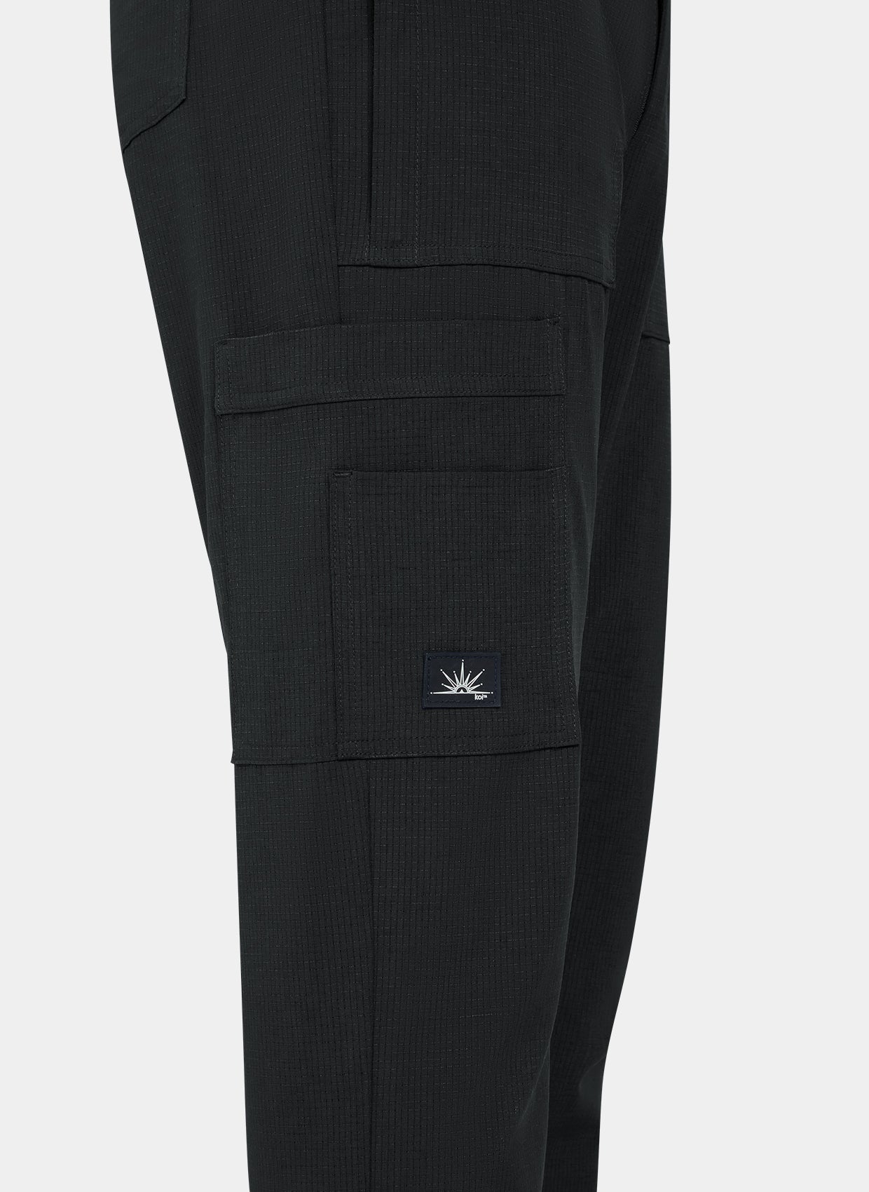 Close-up men's Koi Solis black scrub trousers