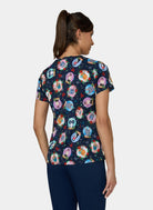 Back view of Koi Basics Leslie scrub top – Holiday Cats print